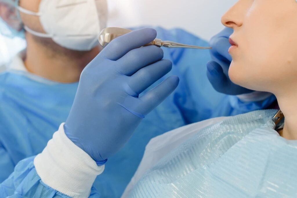 Surgical tooth extraction procedure performed by dentist in Lahore clinic