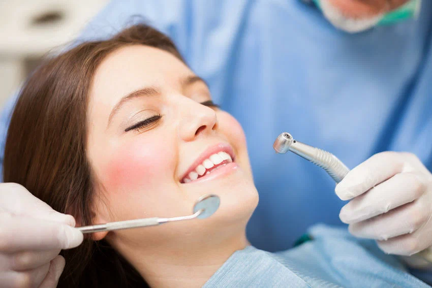 Dental clinic in Lahore with modern dental chair and professional dentist treating patient